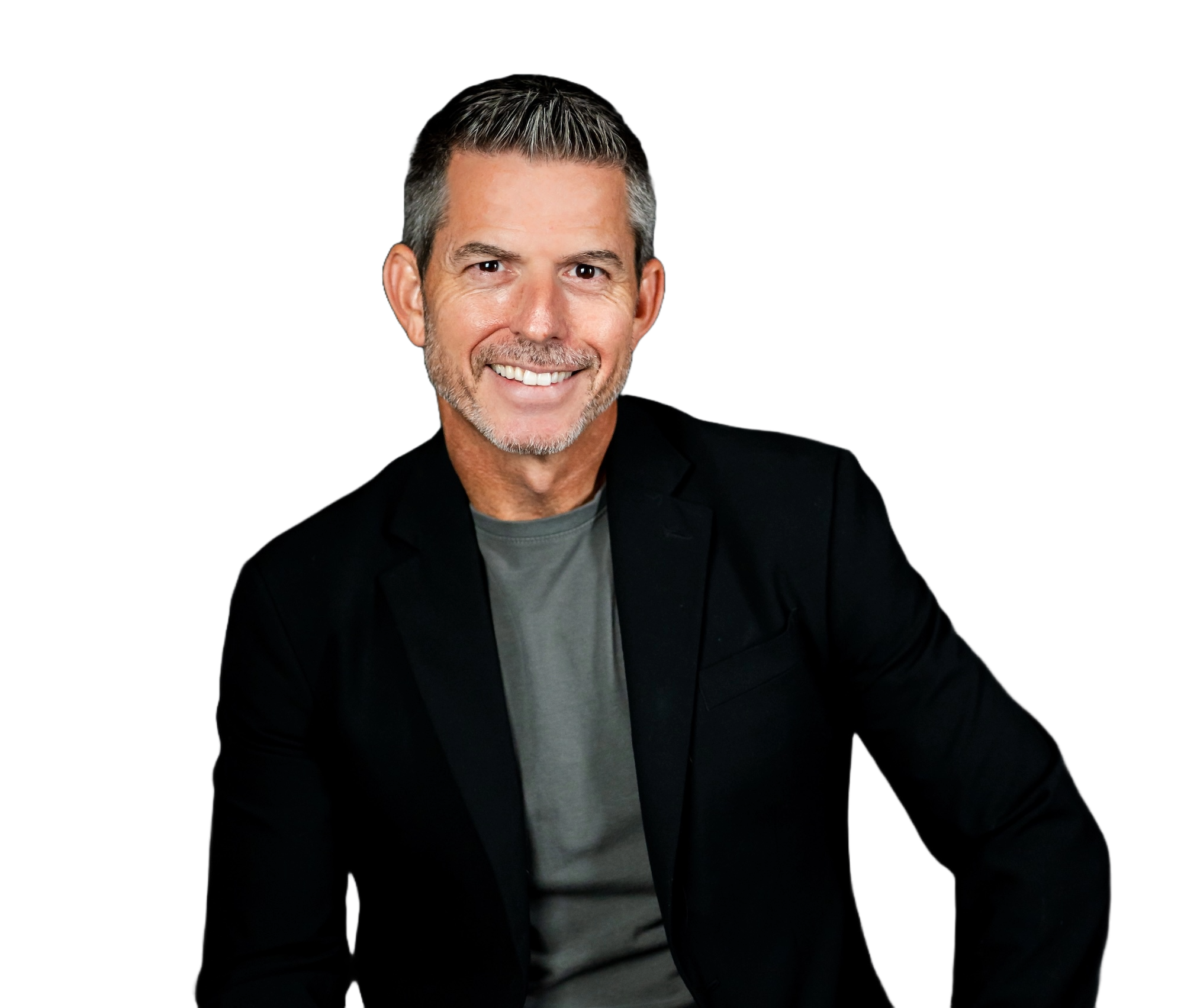 Shawn Condra, motivational speaker and mindset coach, smiling confidently against a warm red background